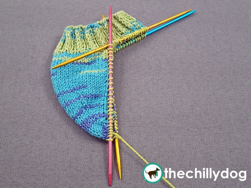 Pick up and knit stitches along the edge of a heel flap.